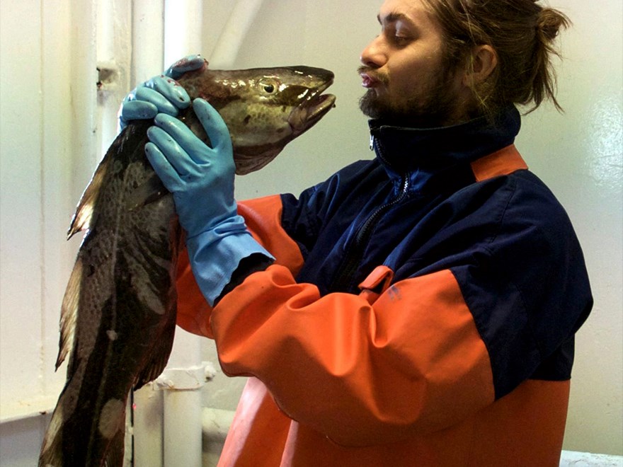 Man kissing a cod