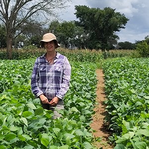 Chloe MacLaren standing in a soybean plot.
