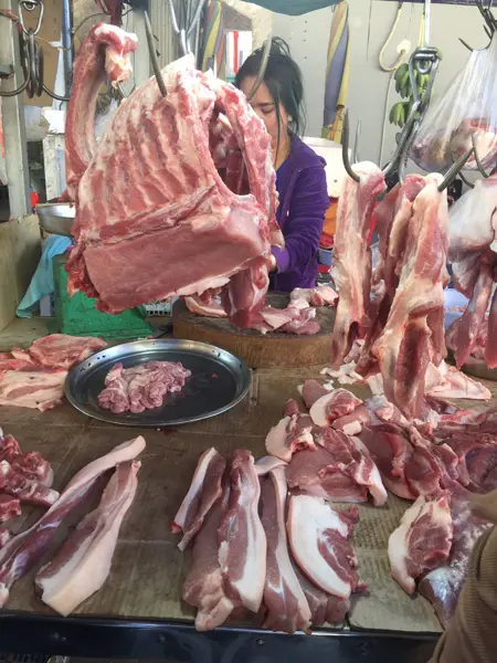 Pork is displayed at an informal market in Cambodia. Photo.