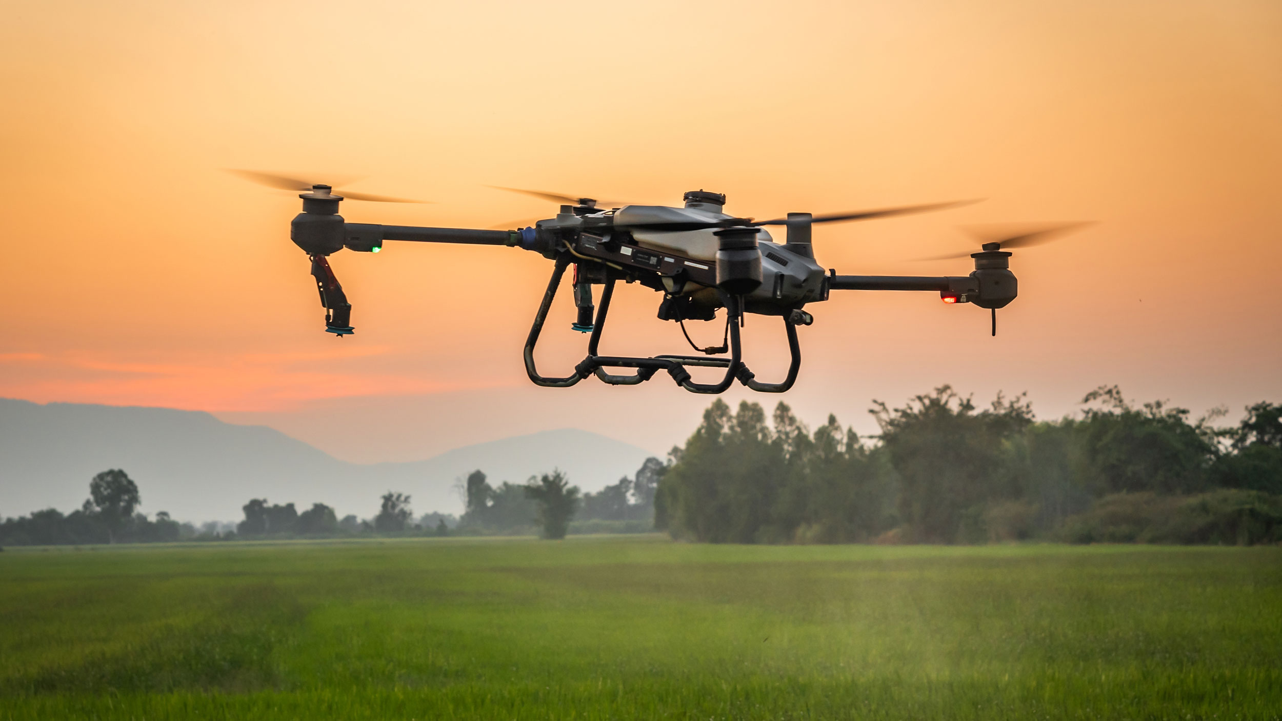 Drone hovering over agricultural field. Photo: Shutterstock