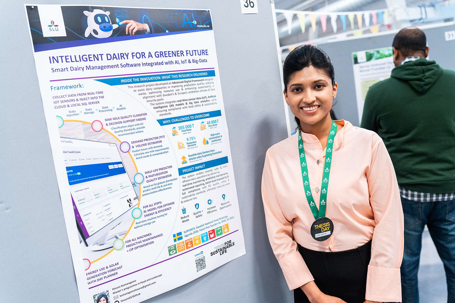 Student standing by her scientific poster. Photo Joe Miller.
