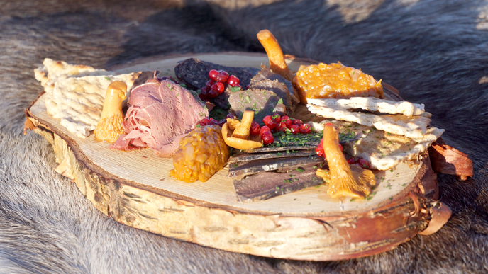 Sami food on a birch board.