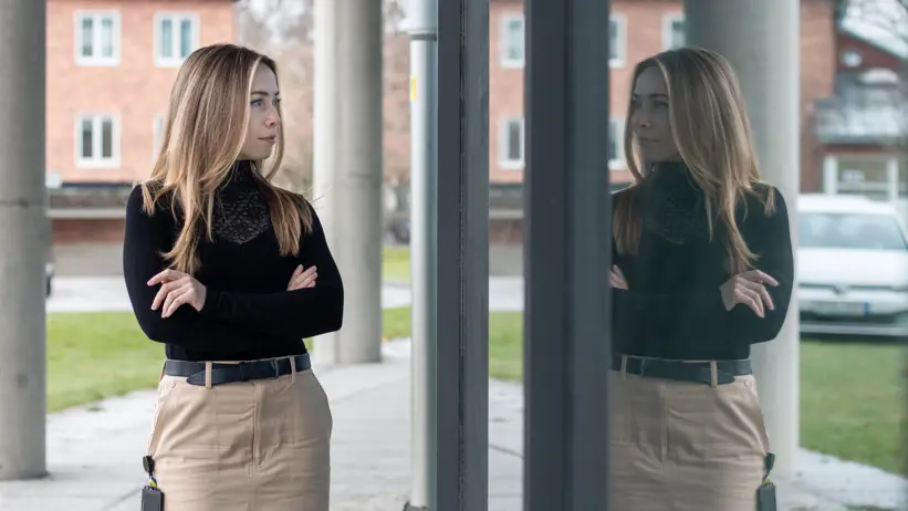Portrait of a woman (Khrystyna Kurta, SLU) with outdoor reflection.