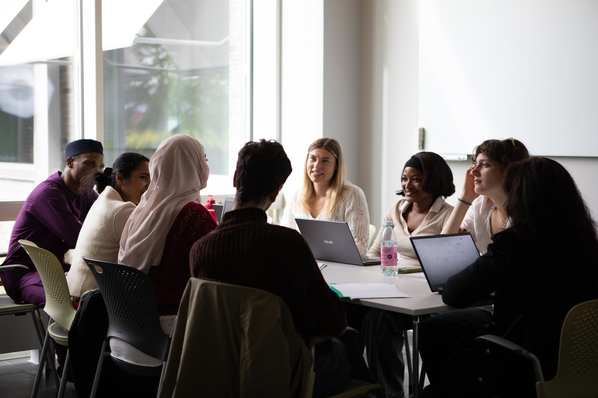 A group of students gathered around a table