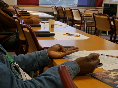 Participants holding seeds in their hands during the reflective process.
