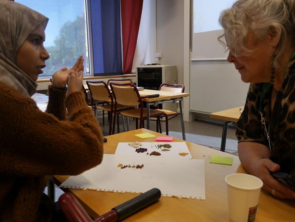 Participants sharing their story behind the art they created.