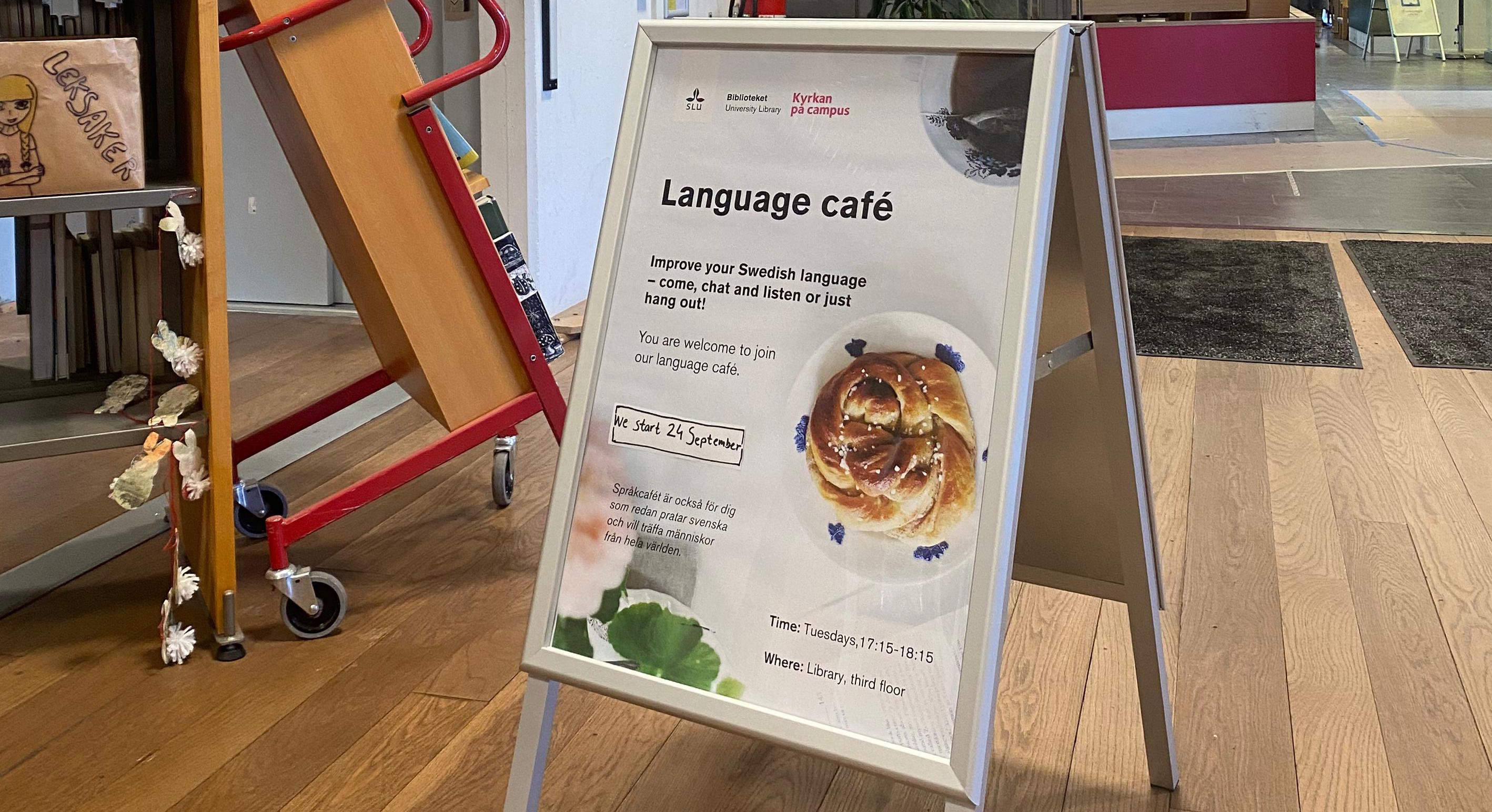 A picture of a sign informing about SLU's language café