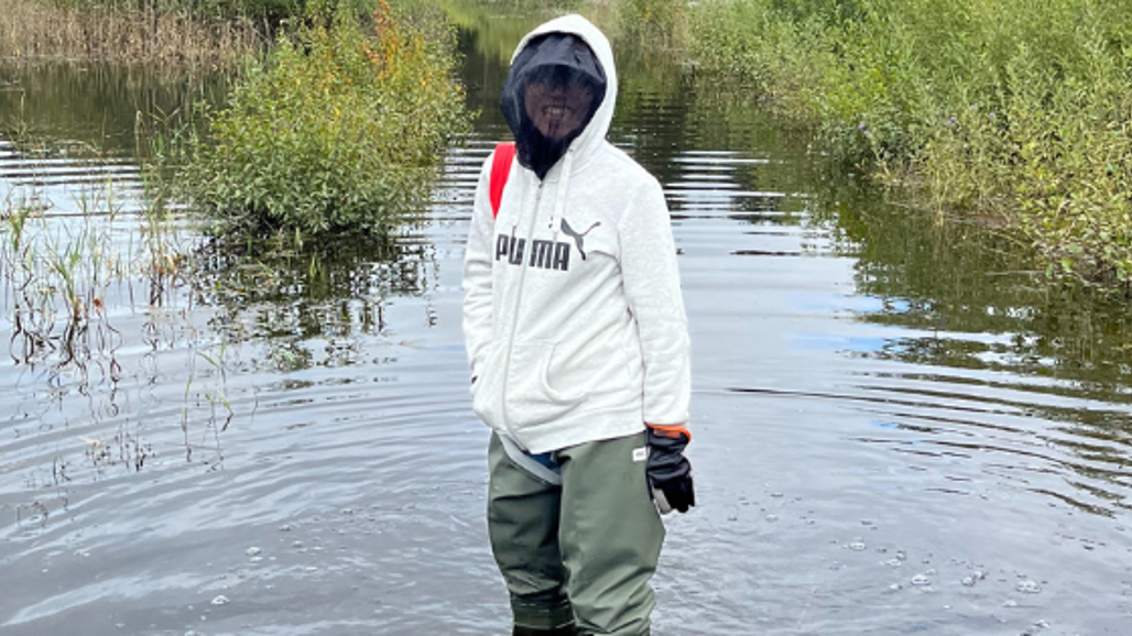 woman standing in a lake