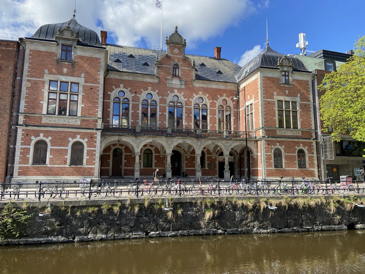 Norrlands Nation, a red brick building with a balcony and towers.