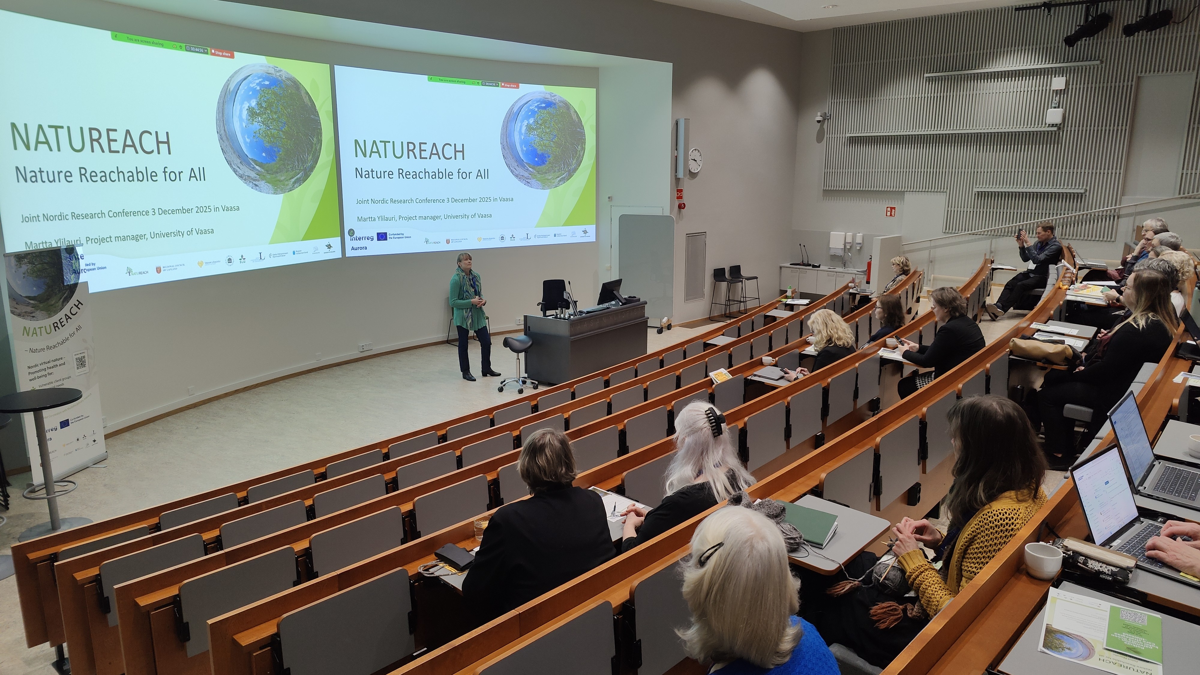 Presentation in auditorium with two screens
