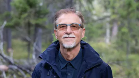 Picture of a man in a forest.