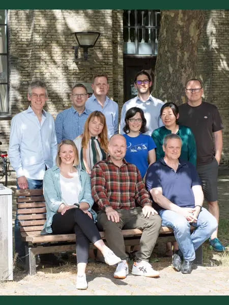 Group photo of researchers lined up outdoors.
