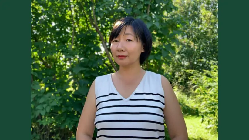 Portrait of a woman (Keni Ren) outdoors during summer.