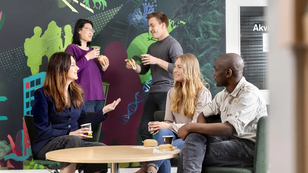 Students talking around a table