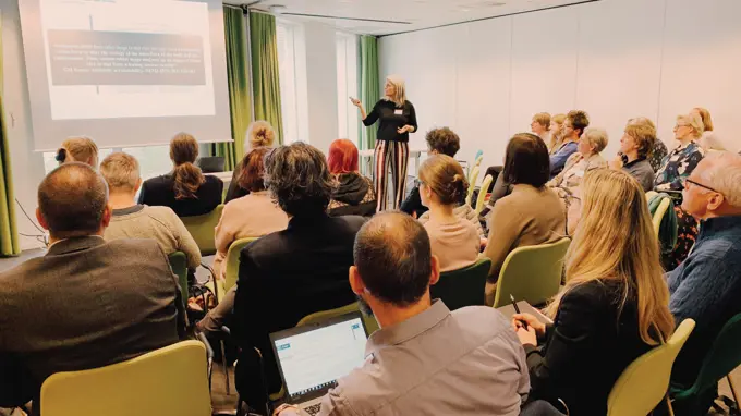 A lecture with an audience. Photo.
