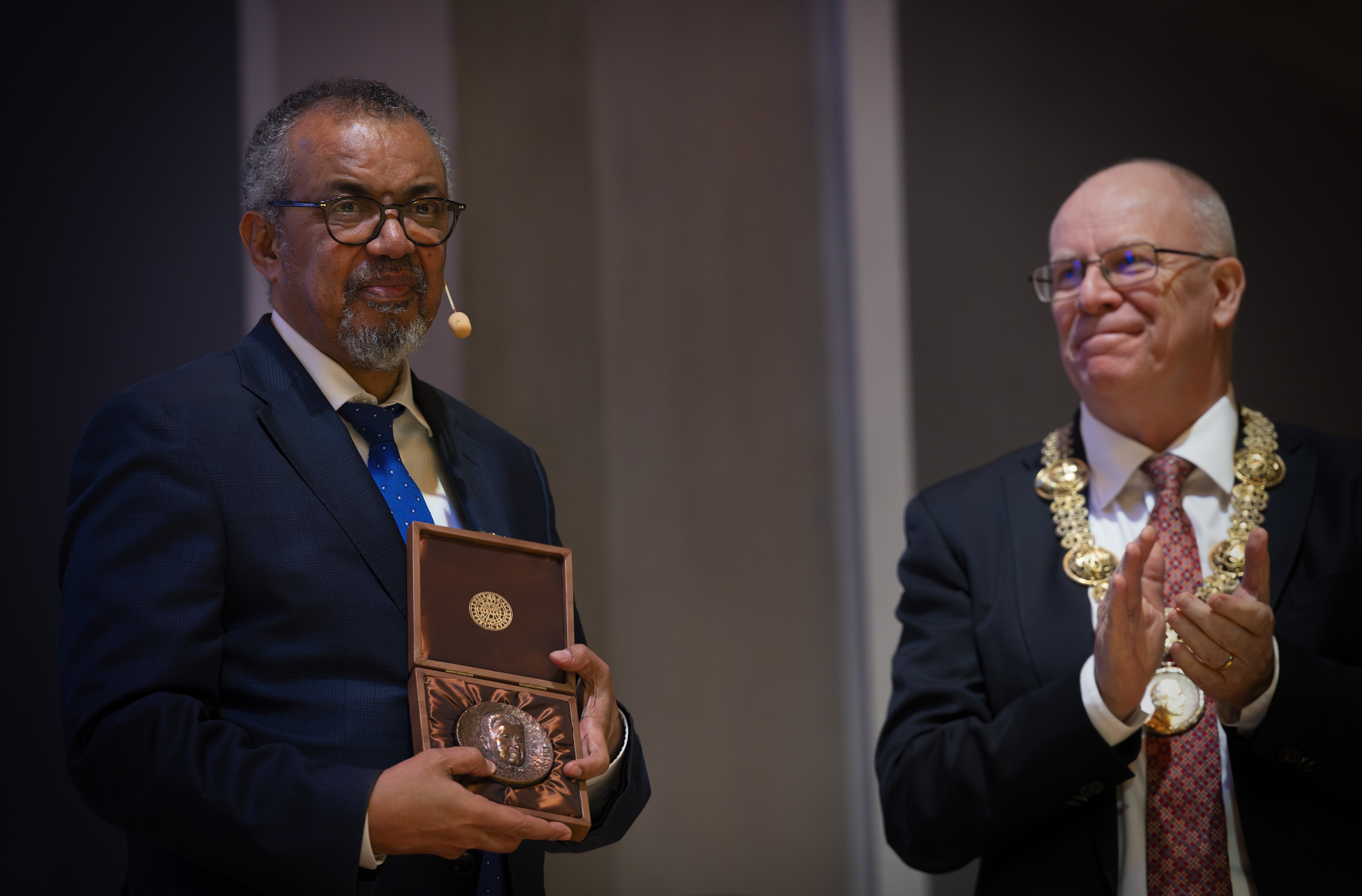 Man holding his award