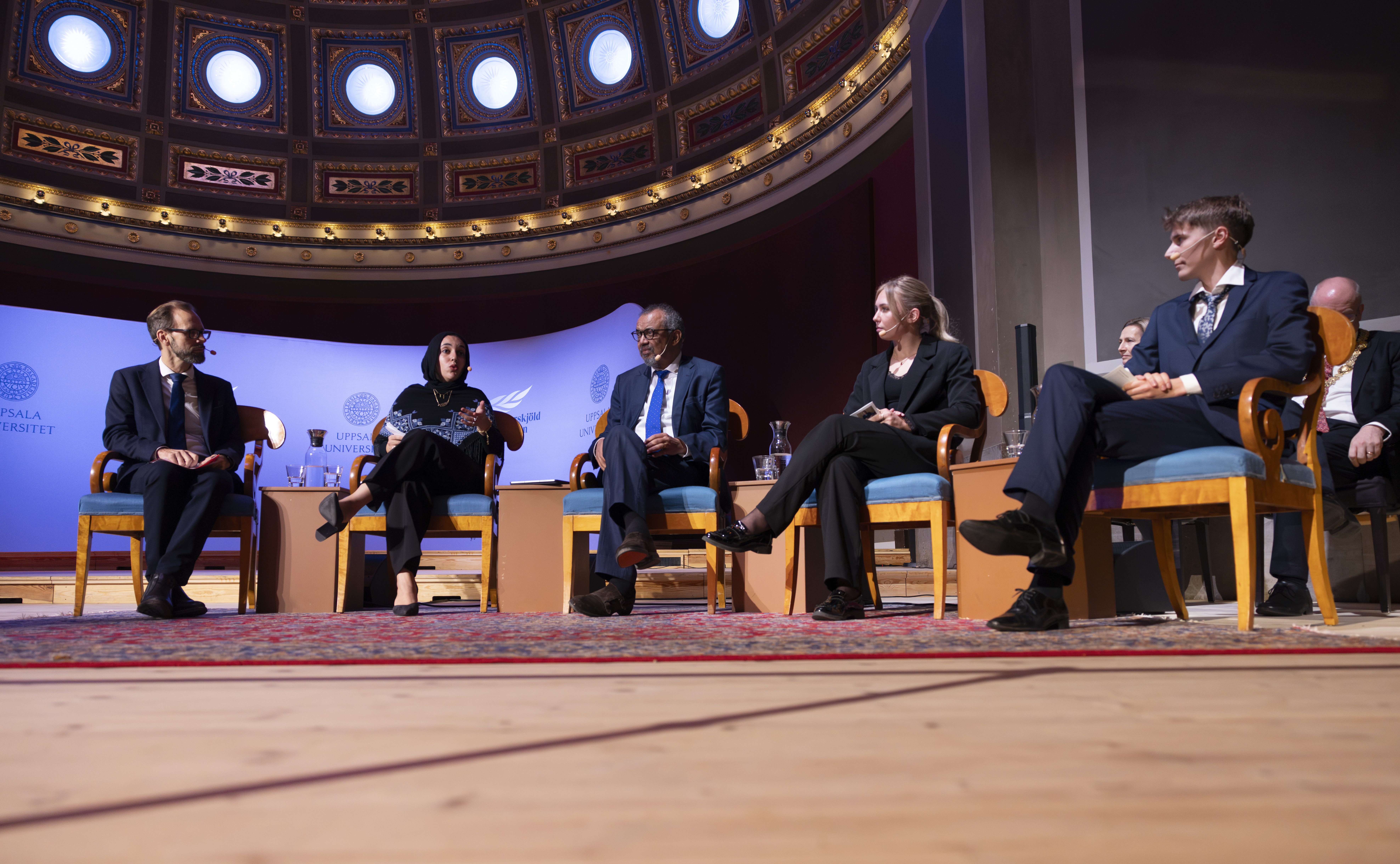 Five persons on stage