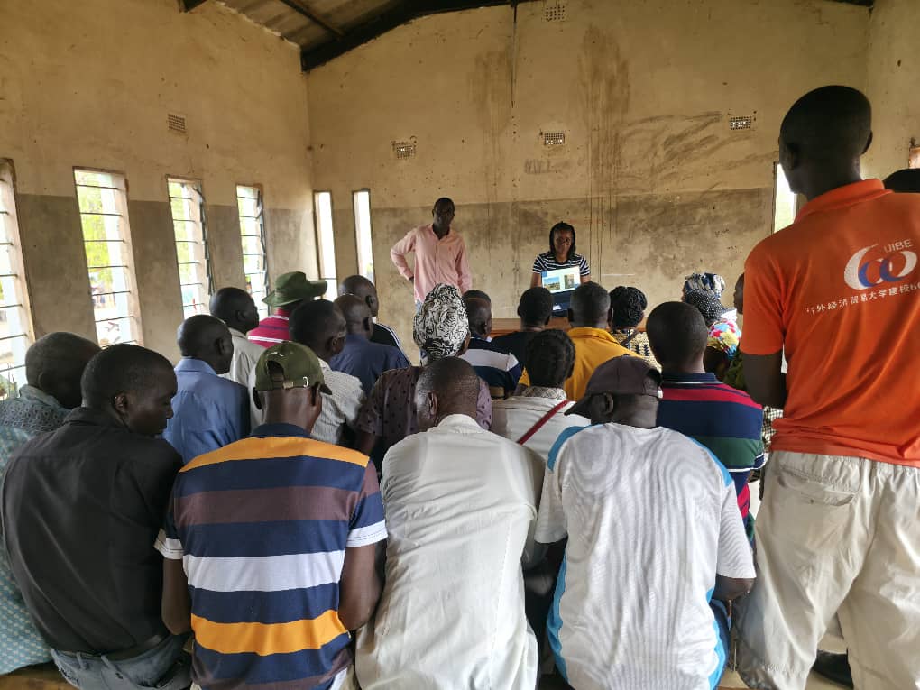 Farmers reviewing goat health pictures on the laptop during the workshop. Photo: N. Nanguna