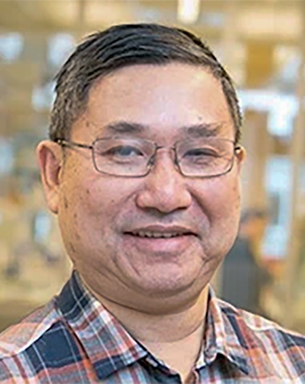 Portrait photo of a man indoors.