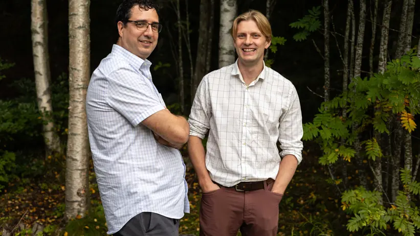 two men in birch forest