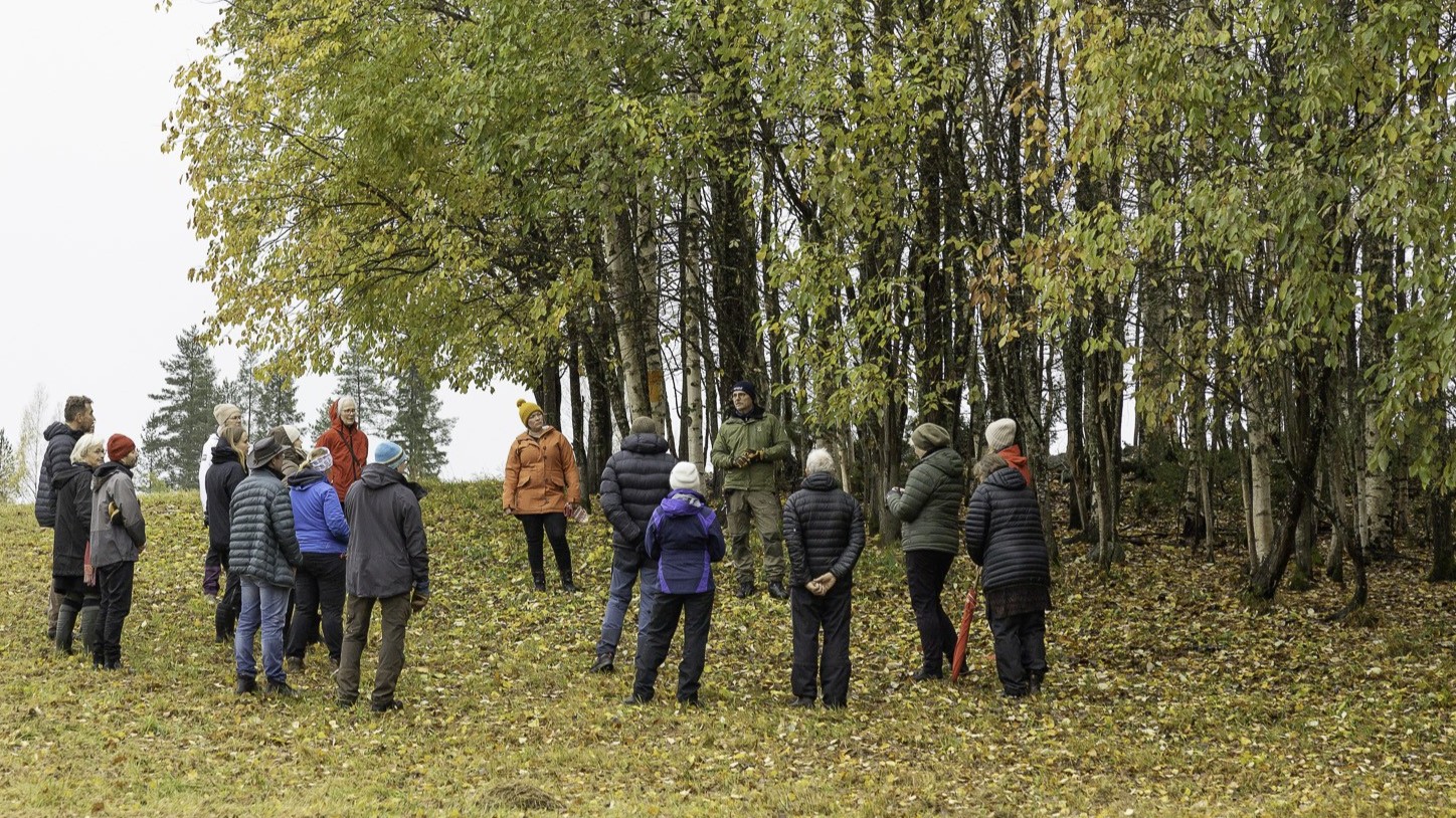 Group of participants on a field excursion in a forest as part of the REGGAE project.