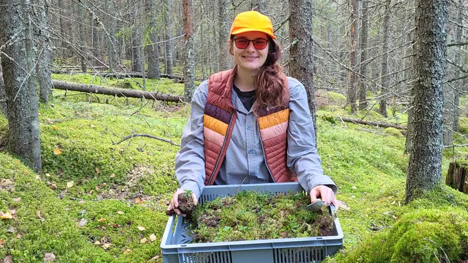 An outdoorsly dressed woman wearing a