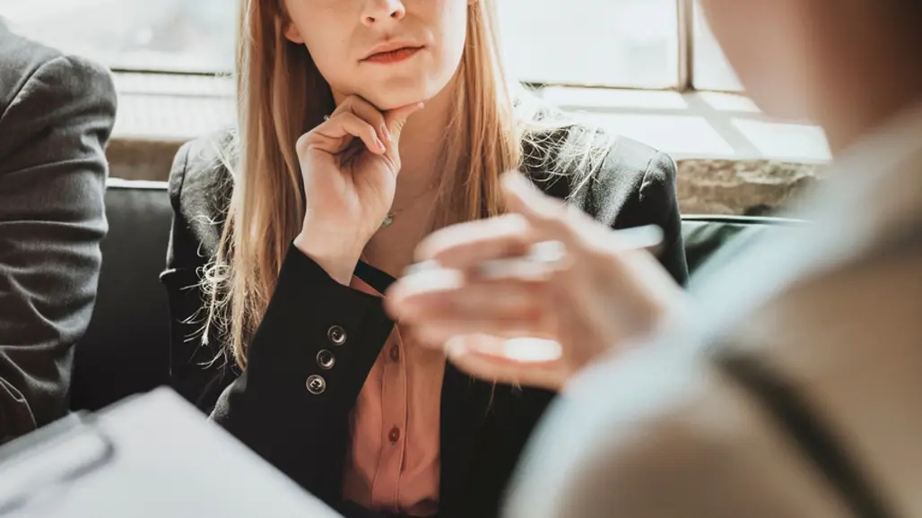 Photo of people talking.