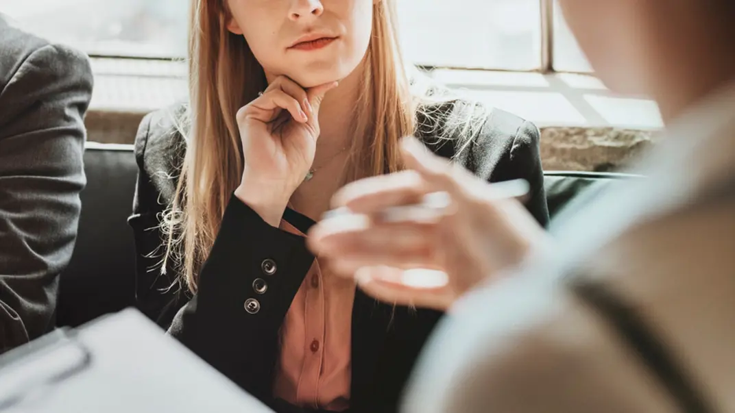 Photo of people talking.