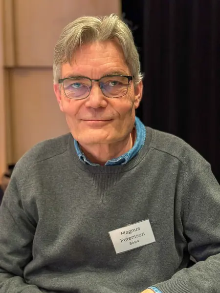 Portrait of Magnus Petersson from Södra, seated indoors.