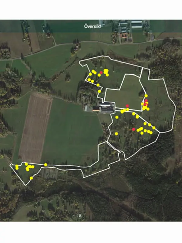 GPS-karta med gula och röda prickar som visar vart djuren befinner sig, i en hage.