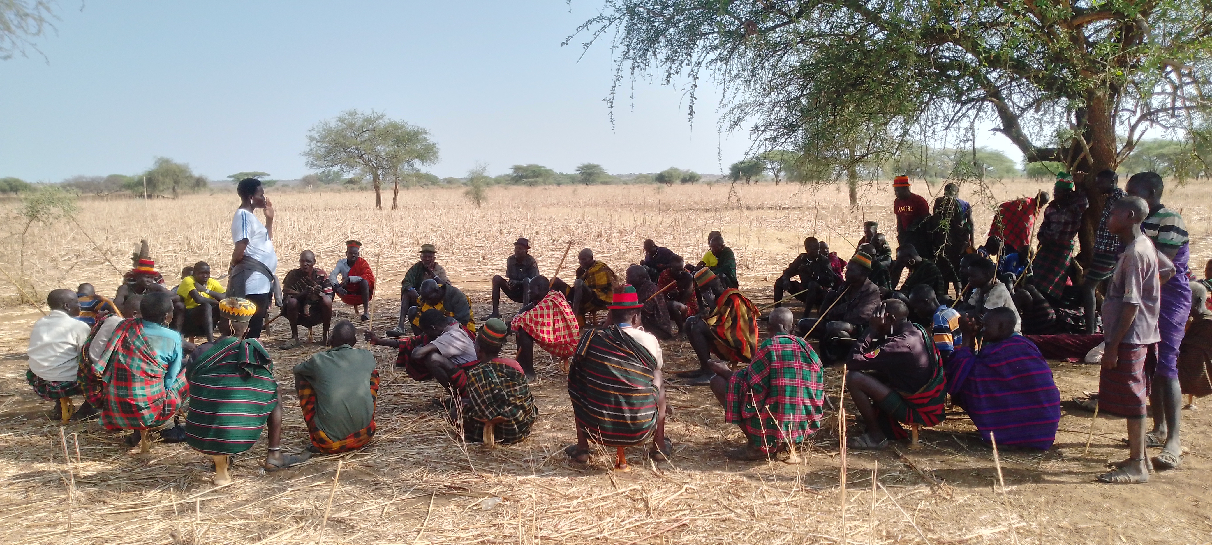 Community members gathered in the Livestock Café in Rupa, Moroto District, Uganda. Photo: Z. Angella