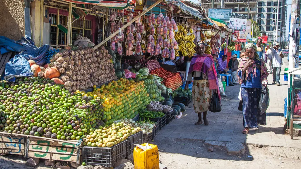 A market outdoors with fruit vendors. Photo.