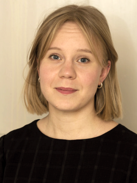 A woman in a black sweater. Photo.