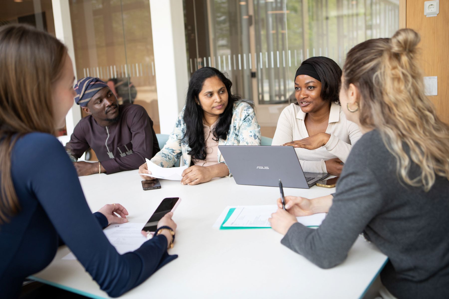 Students sitting around a table
