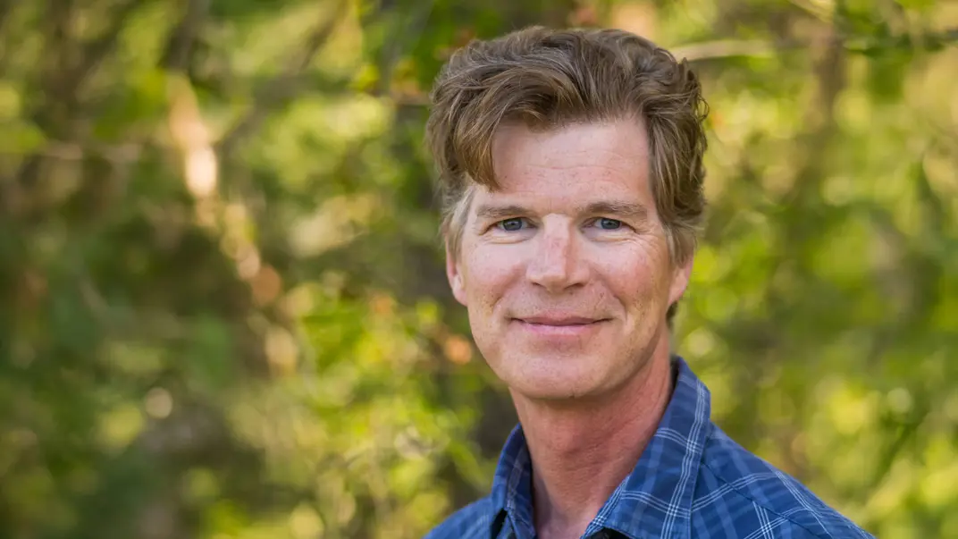 Portrait photo of a man outdoors.