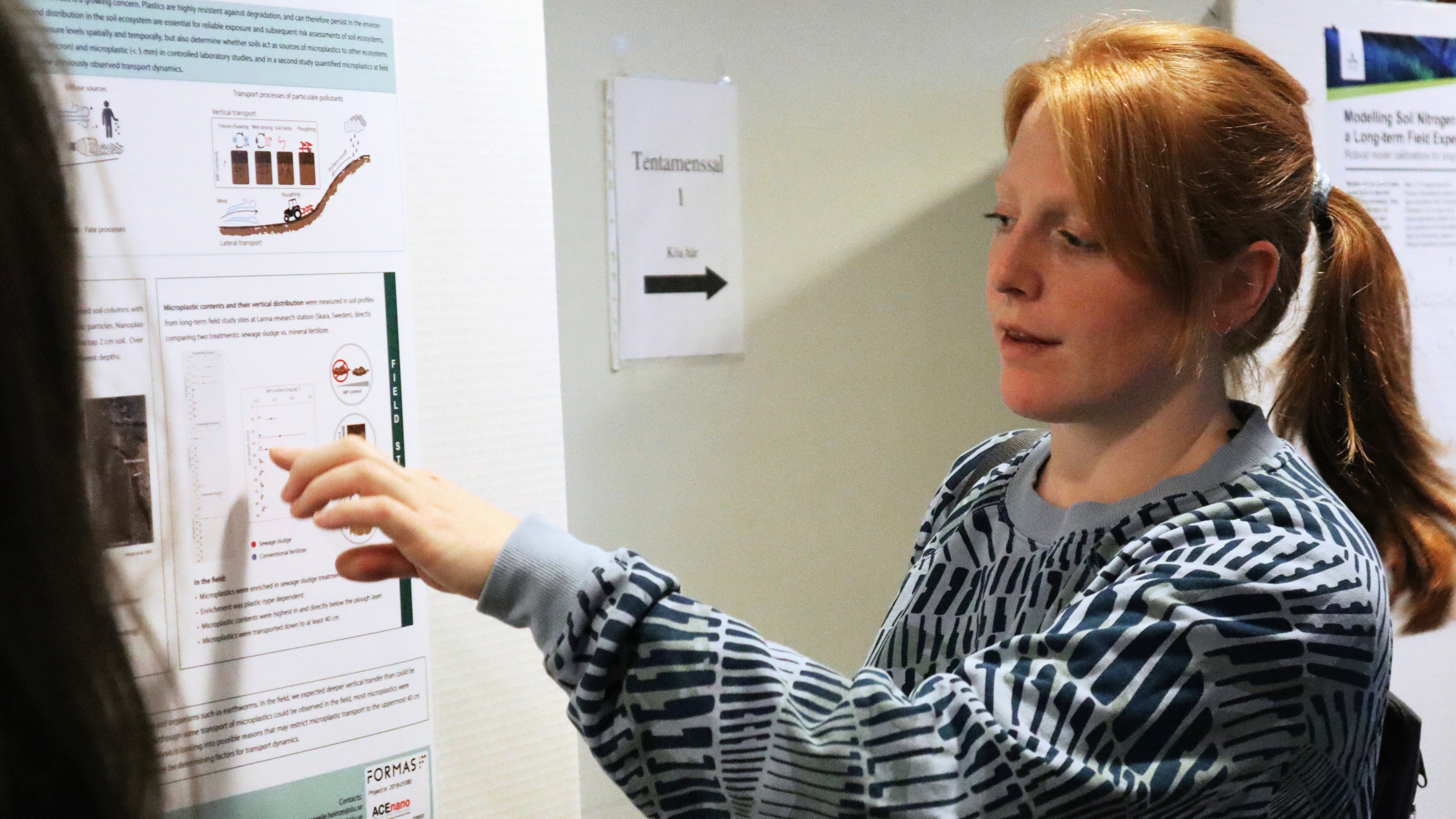 woman in front of research poster