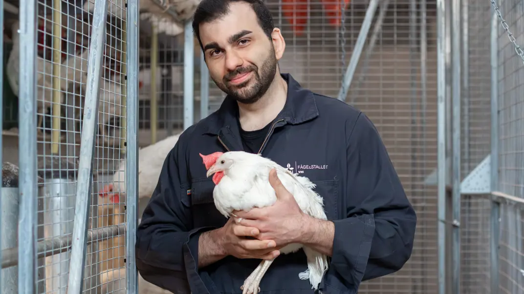 Portrait of Homayoon Davam with poultry.