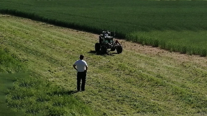 Autonomous tractor driving on a field.