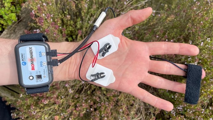 A hand with equipment. Photo.