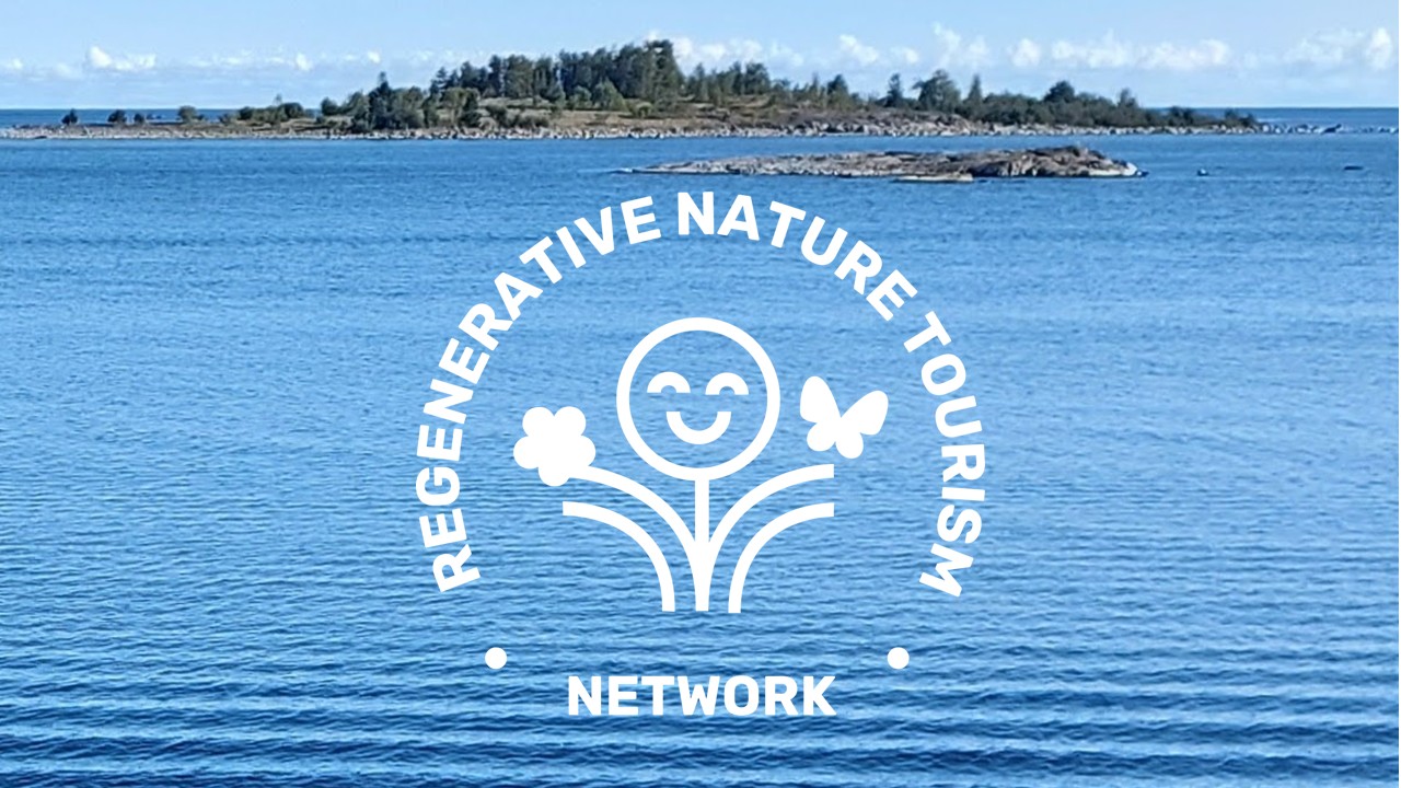 Blue sea and an island in the archipelago with the logo for Regenerative Nature Tourism Network centered in white.
