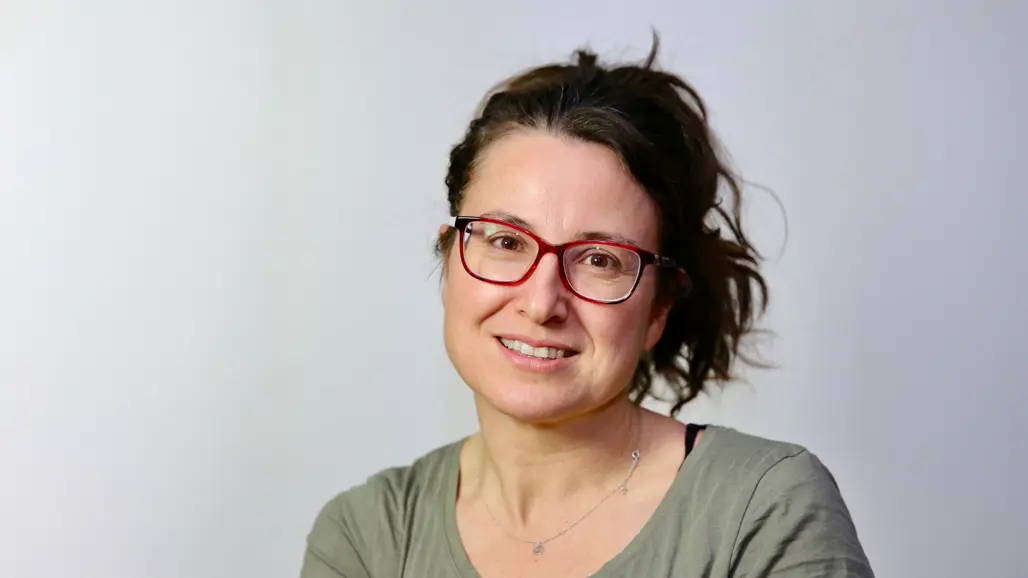 Portrait photo of a woman indoors.