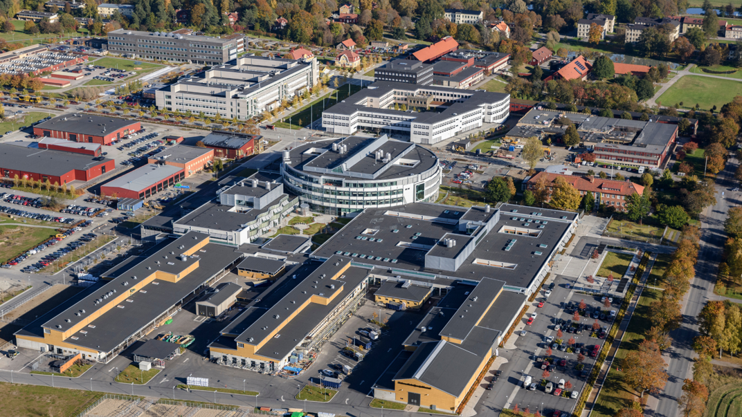 Aerial photos showing buildings above and trees surrounding the buildings.
