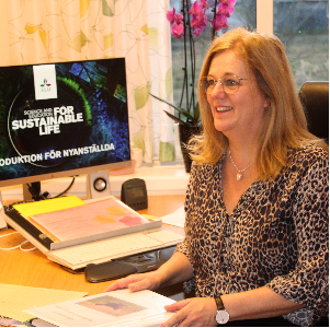 Human Resources Administrator, Susanne Lindwall are sitting at her desk, photo