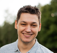 Portrait photo of a smiling man outdoors. Photo. 