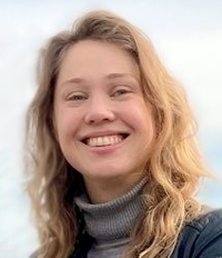 Portrait photo of a smiling blonde woman. Photo.