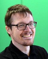 Portrait photo of a man against green background. Photo. 