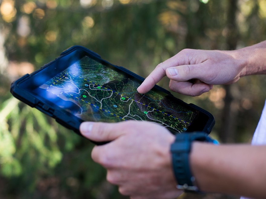 Hands holding a surf tablet