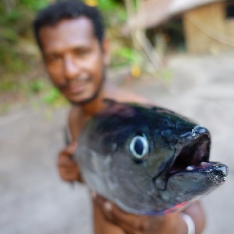 Man holding a fish.