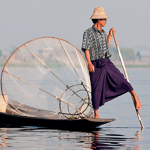 Fisherman in boat in Burma