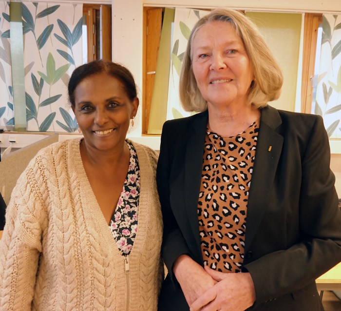 Two women looking into the camera.